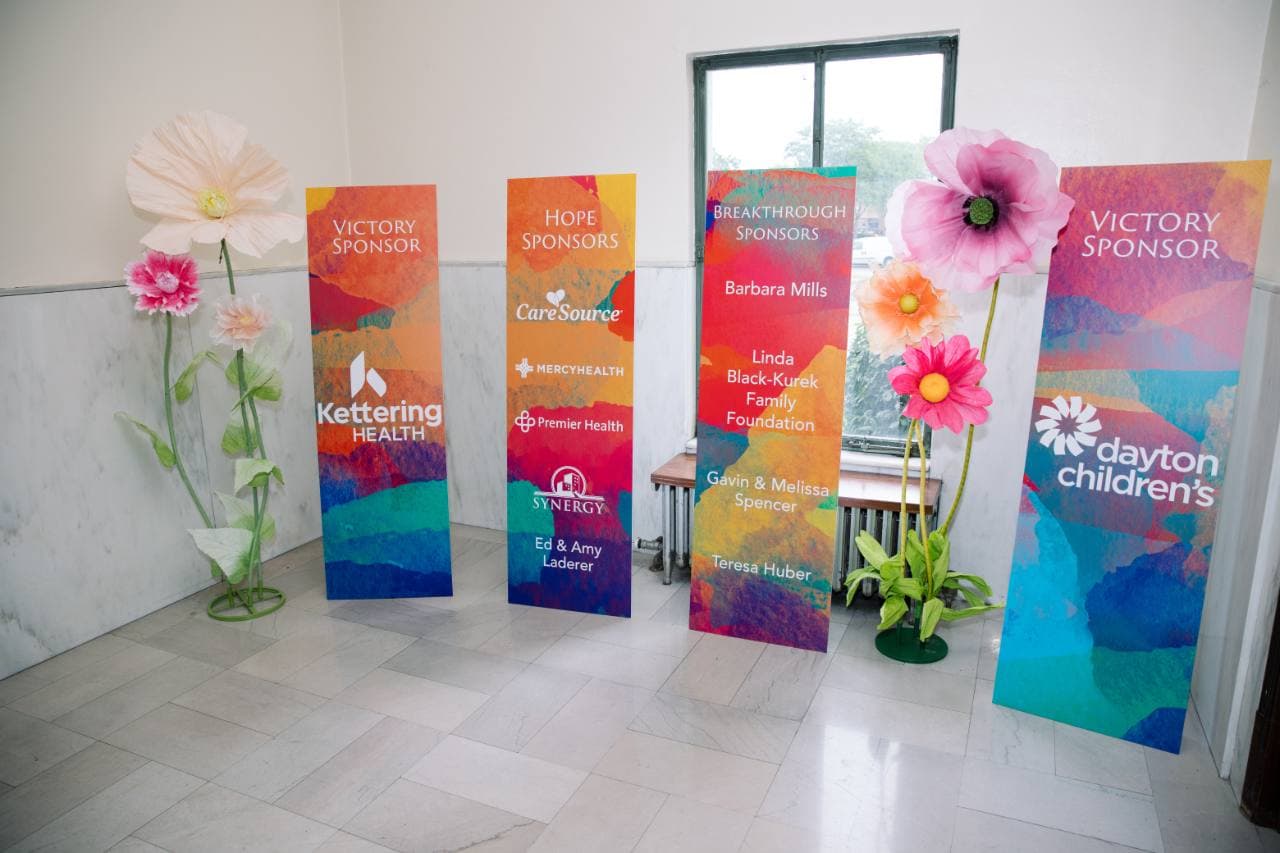Freestanding sponsor boards with colorful Gala of Hope artwork and sponsor names